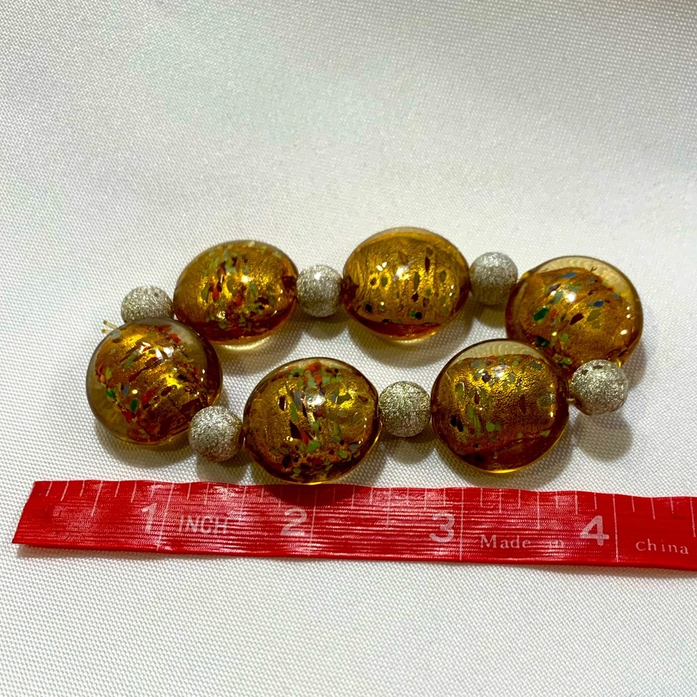 Brown/green/gold spotted discs, stretchy bracelet